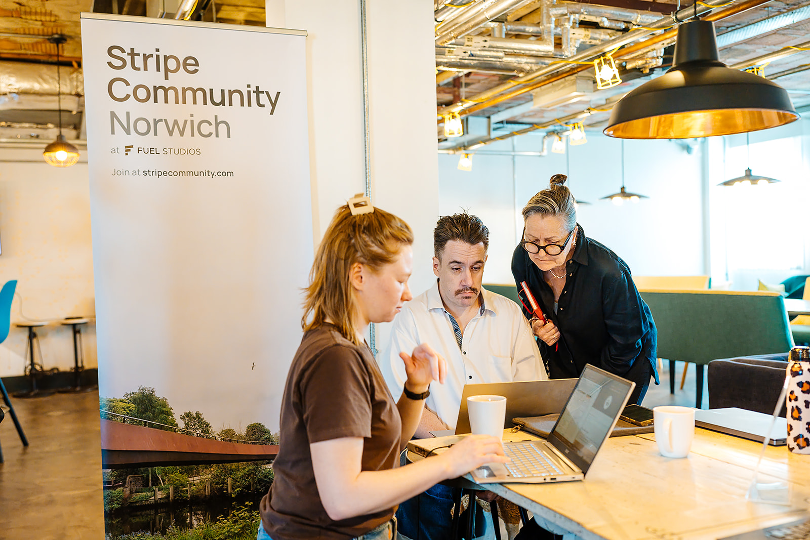 Working beside the Stripe Community banner